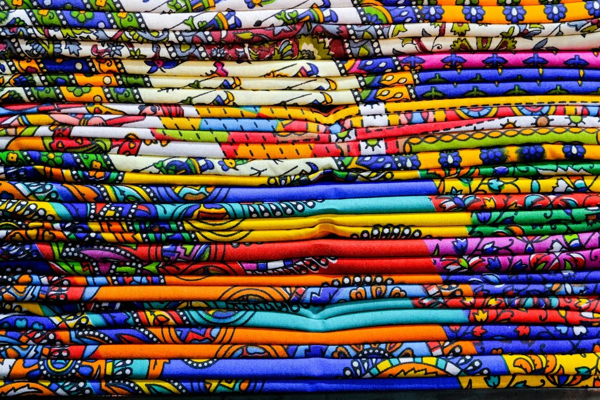 Stacks of brightly patterned African wax-print fabric