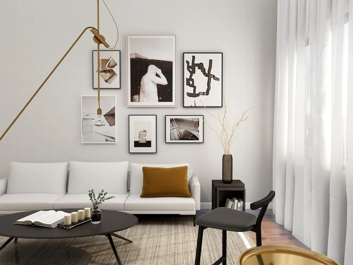 Small living room with a framed gallery wall and a single mustard accent cushion