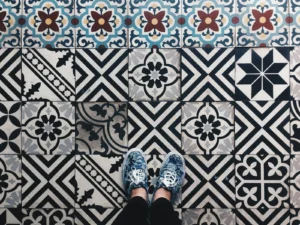Waterproof Peel-and-Stick Floor Tile in a Rental Bathroom: A 14-Month Renter Review (and 5 Brands That Actually Hold) Renter bathroom floor with encaustic patterned peel-and-stick floor tile in black and white