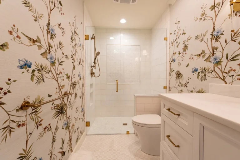 Bathroom with red rose pattern wallpaper and a freestanding tub