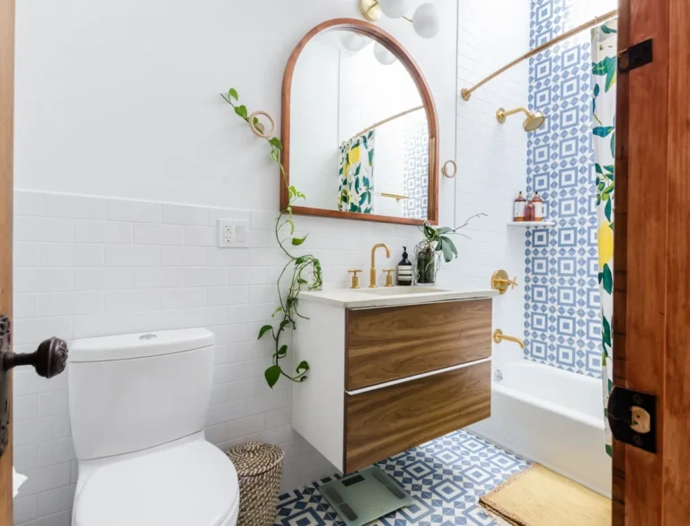 Bright bathroom with a blue diamond pattern wallpaper accent