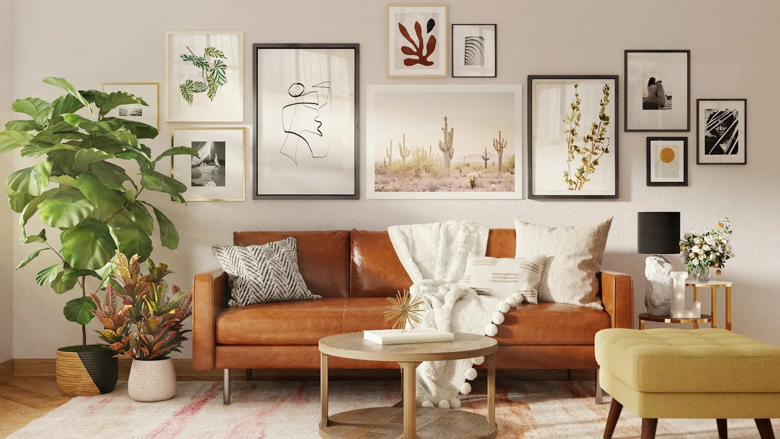 Boho living room with a leather sofa, gallery wall, layered throw and a fiddle-leaf plant