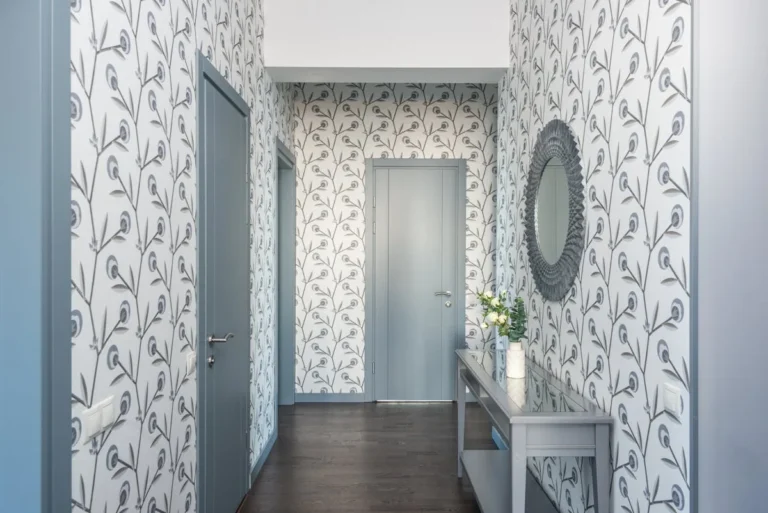 Hallway with designer-led bird-and-vine peel-and-stick wallpaper pattern in maximalist scale