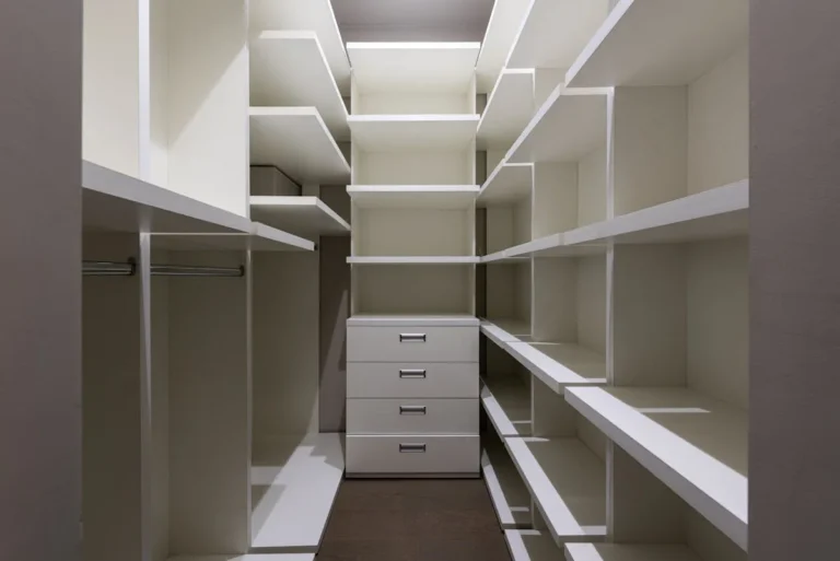 Slim drawer unit on a closet floor