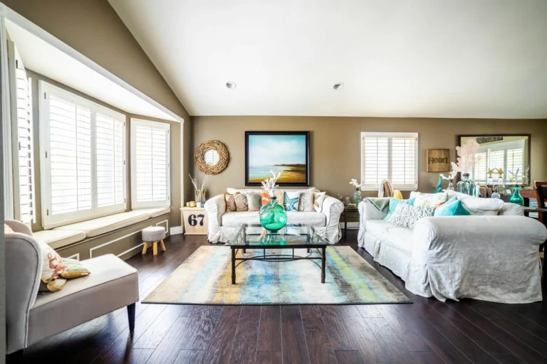 Bright coastal grandmother living room in blue and white with slipcovered sofas