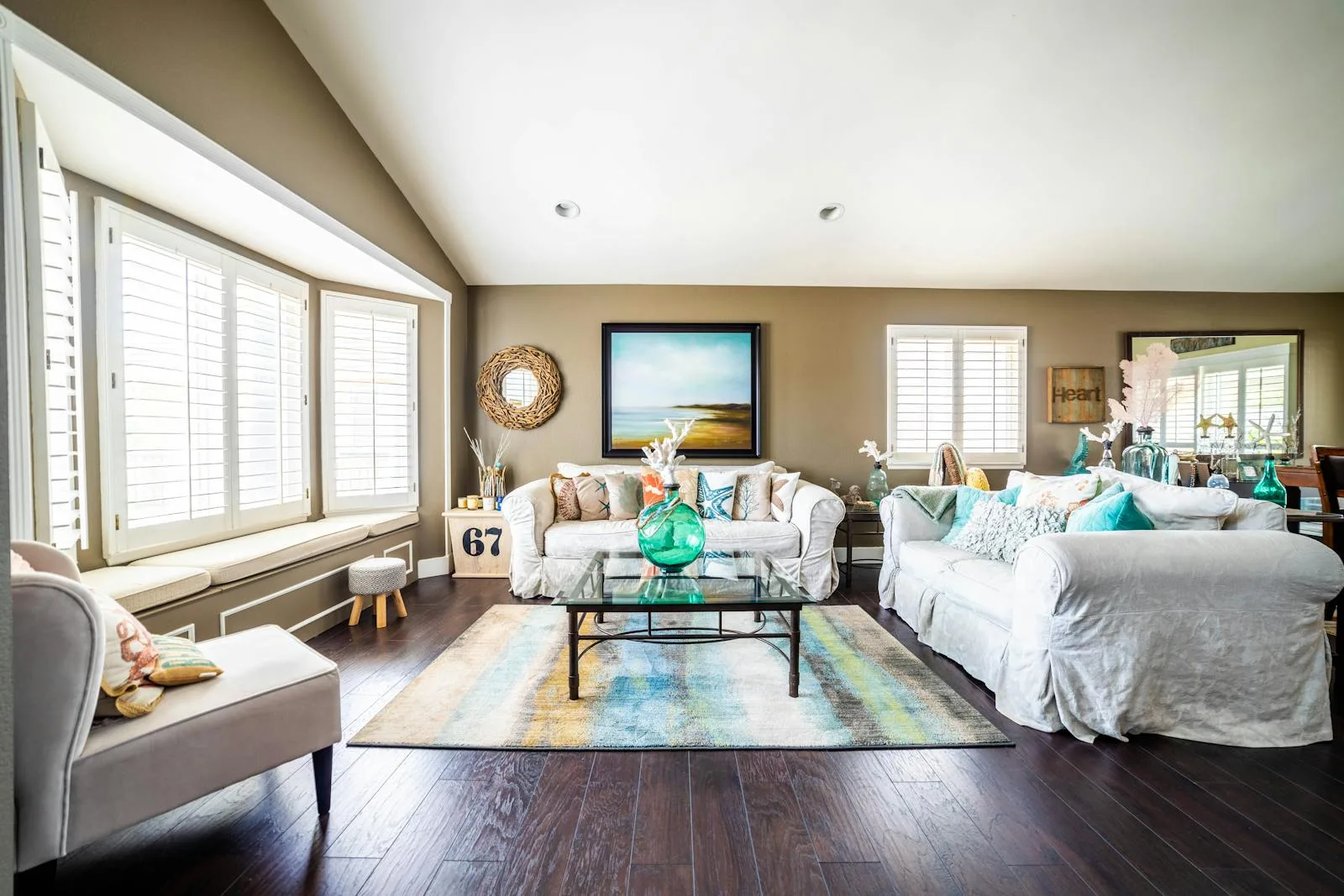 Bright coastal grandmother living room in blue and white with slipcovered sofas