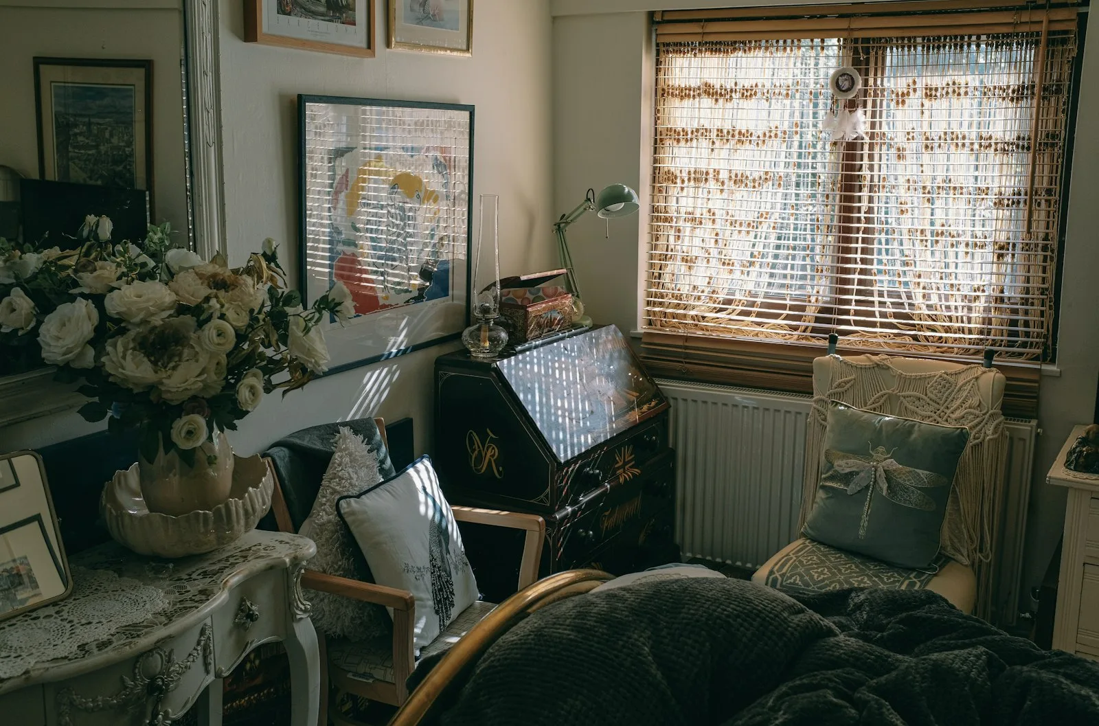 Cottagecore room with florals, vintage furniture, and a sunlit window