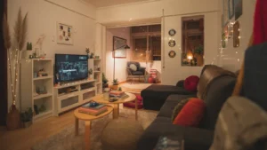 Cozy Apartment Ideas: How to Warm Up a Small Rental Without Touching a Wall Cozy small apartment living room lit by warm lamps in the evening