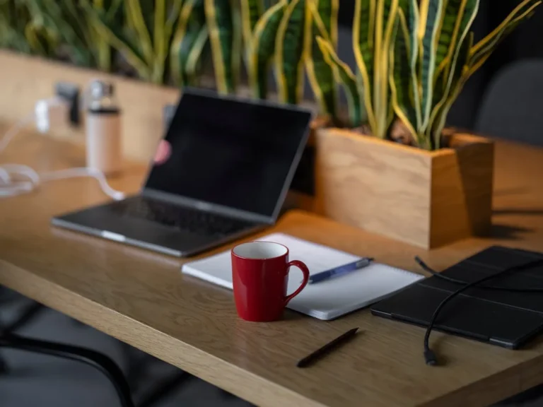 Mug warmer keeping coffee hot on a cozy desk