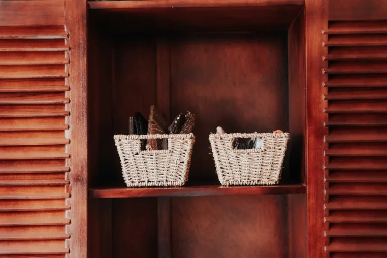 Cube storage organizer with fabric bins against a wall