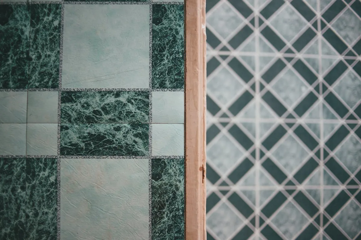 Green marble peel-and-stick floor tile close-up showing the print quality and pattern alignment