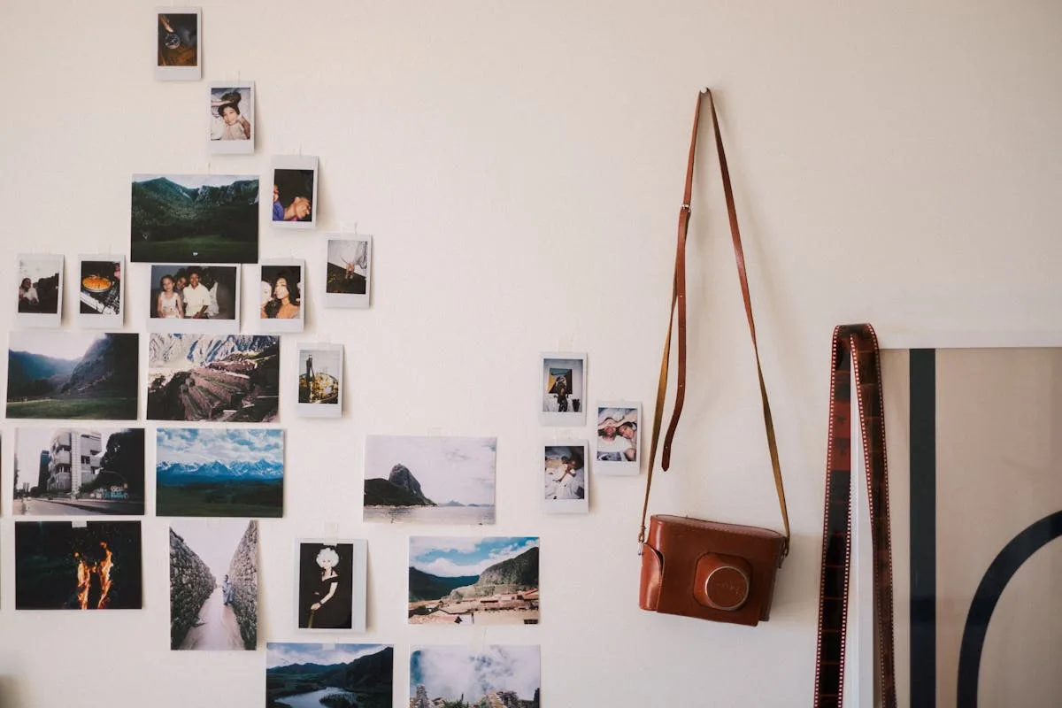 Close-up of an adhesive picture-hanging strip being pressed onto a wall