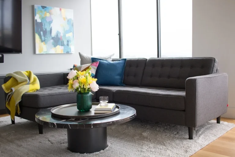 Compact reversible sectional sofa in a small neutral living room