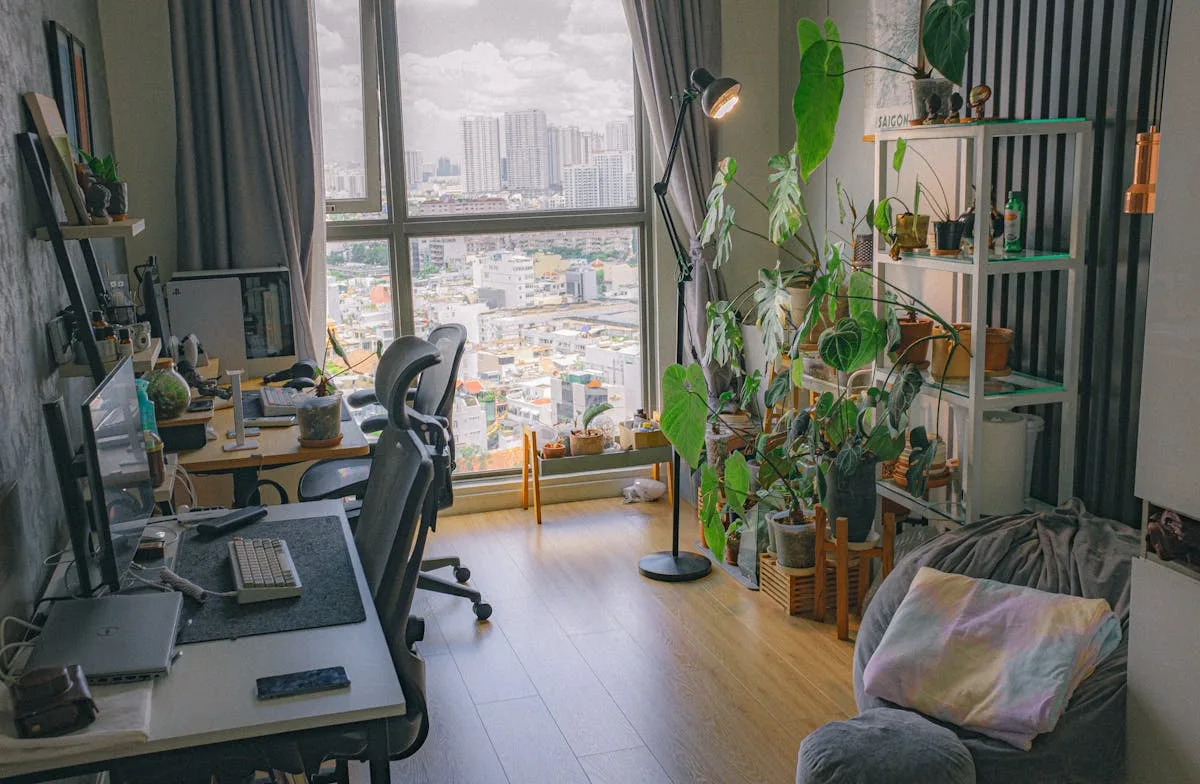 Compact home office desk by a window in a small city apartment