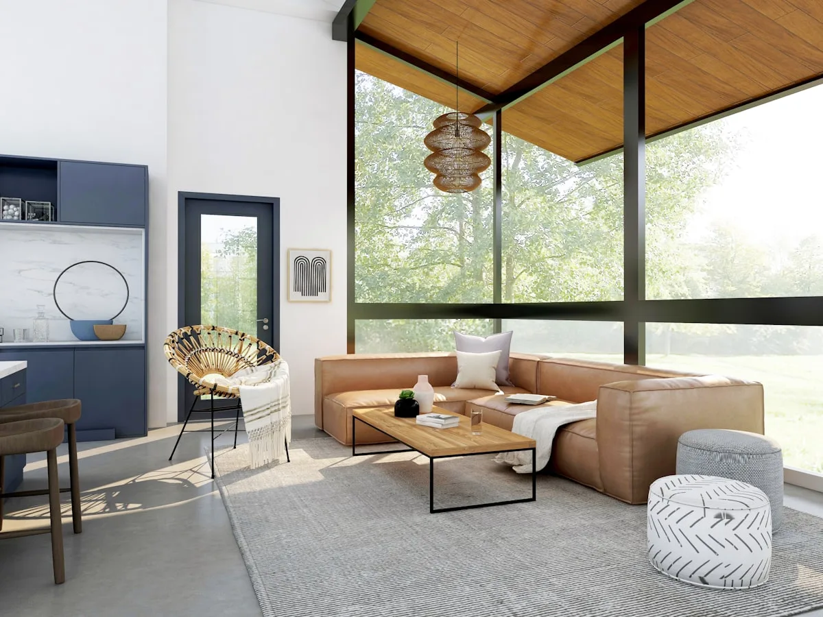 Mid-century modern living room with a leather sofa, wood ceiling and woven accent chair