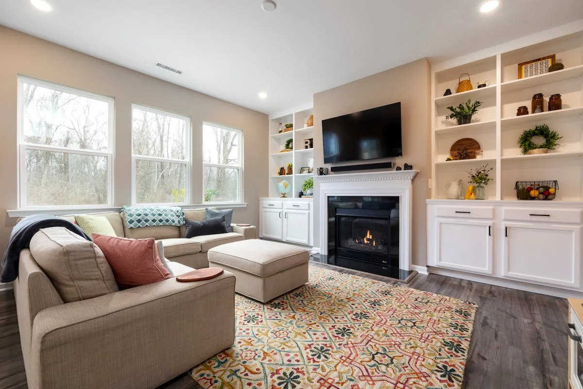 Bright living room with a storage ottoman, a multi-use first apartment essential