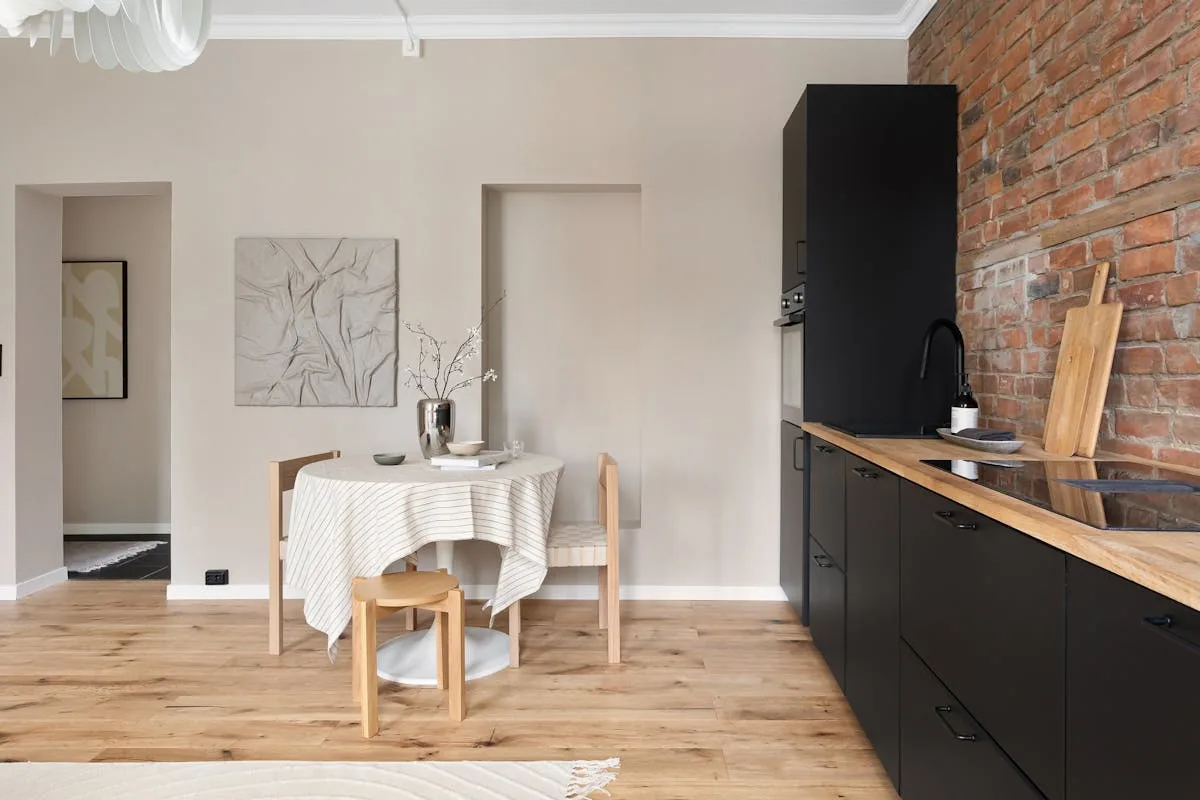 Small dining nook with a compact table and chairs in a one bedroom apartment