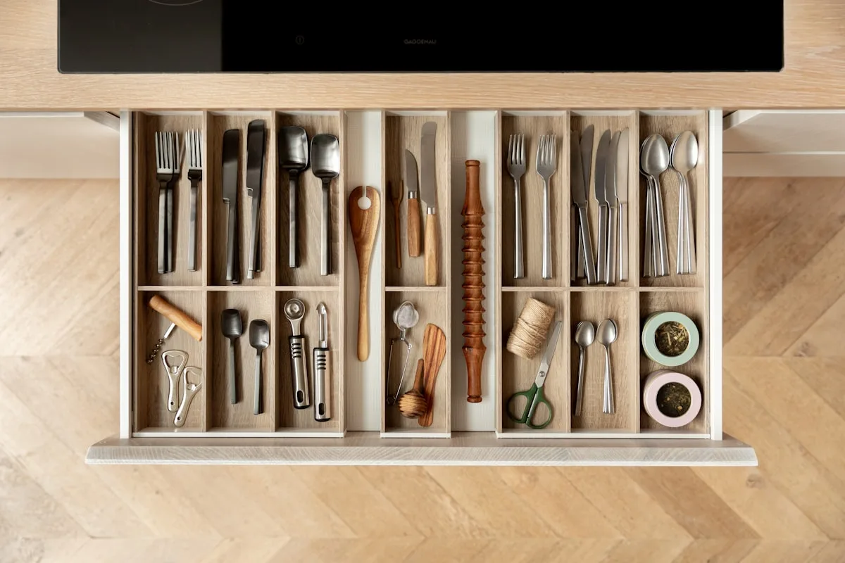 Kitchen drawer with cutlery neatly separated by dividers