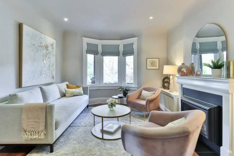 Classic living room with a visible crown molding line running across the ceiling and bay window