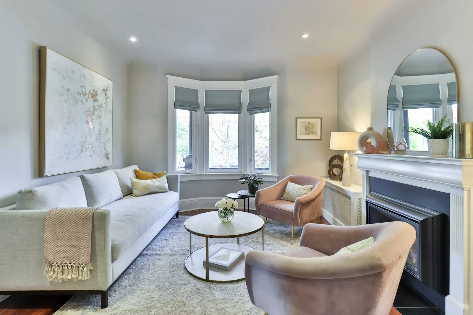 Classic living room with a visible crown molding line running across the ceiling and bay window