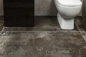 Peel-and-Stick Floor Tile: A Renter Honest Review (5 Brands That Hold, 2 That Do Not) Small rental bathroom with patterned floor tile in muted blue and cream, white subway shower walls
