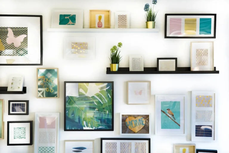 Framed art arranged in a gallery wall in a small apartment