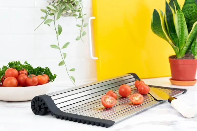 Roll-up dish drying rack laid over a kitchen sink