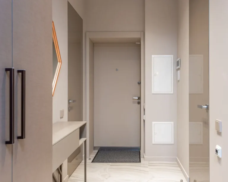Slim vertical shoe cabinet in an entryway