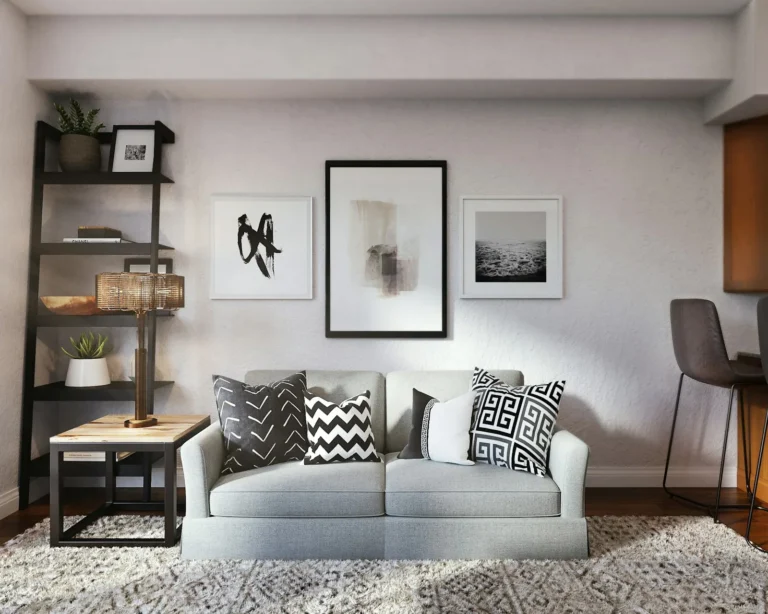 Small apartment living area with a compact sofa and tall vertical shelving