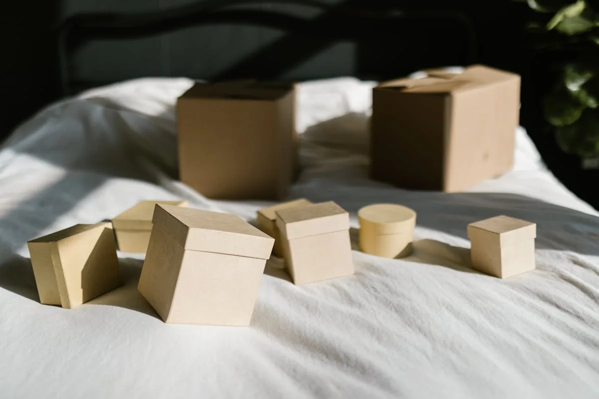 Stackable storage boxes on a bed in a small apartment