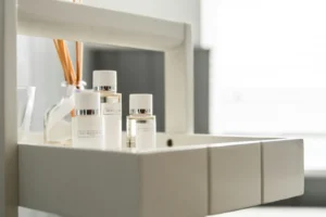Small Bathroom Storage Ideas for Renters: 8 No-Drill Picks That Actually Hold Bright bathroom shelf with neatly arranged toiletries