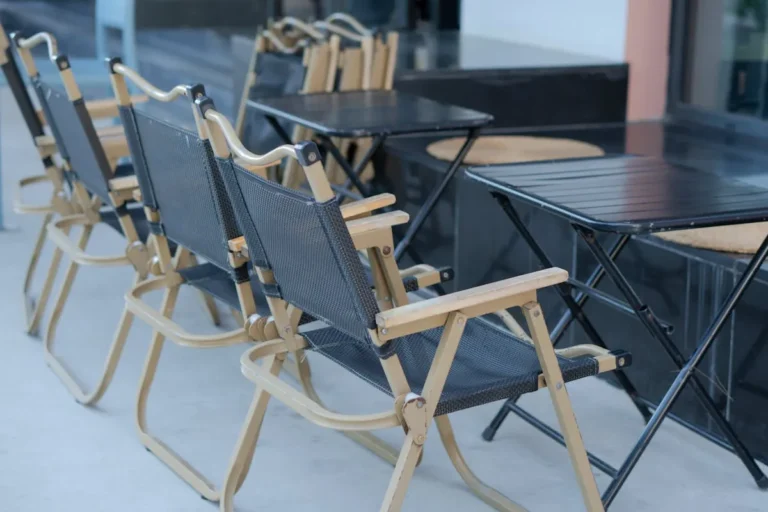 Padded folding chairs at a small dining table