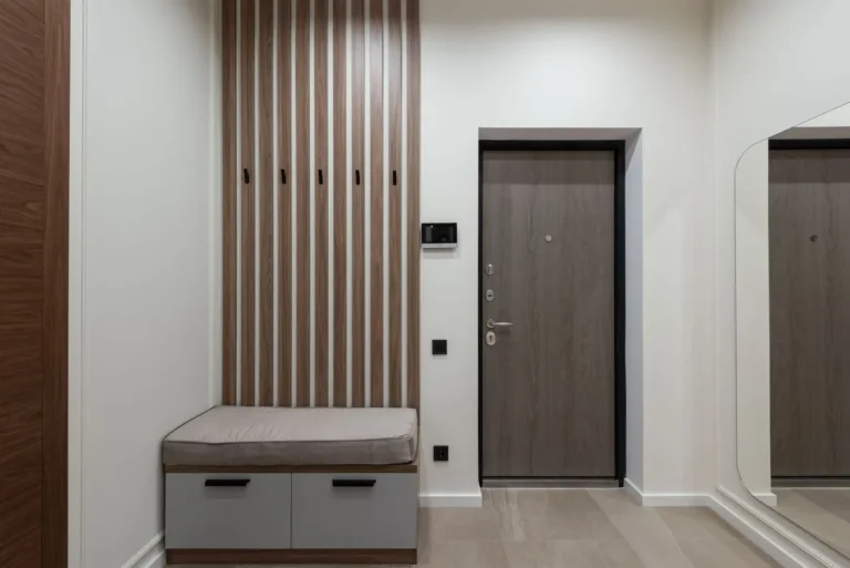 Wooden storage bench in a small entryway