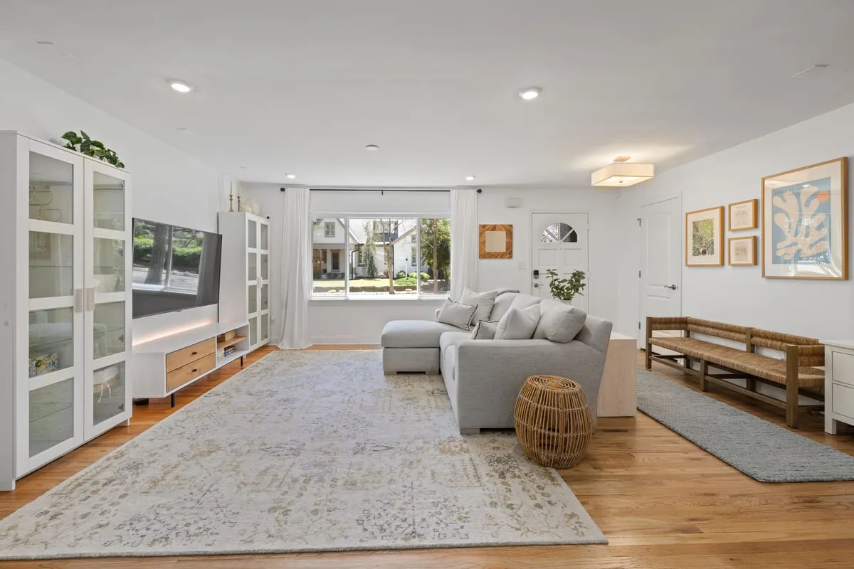 Bright small living room with a storage ottoman doubling as a coffee table