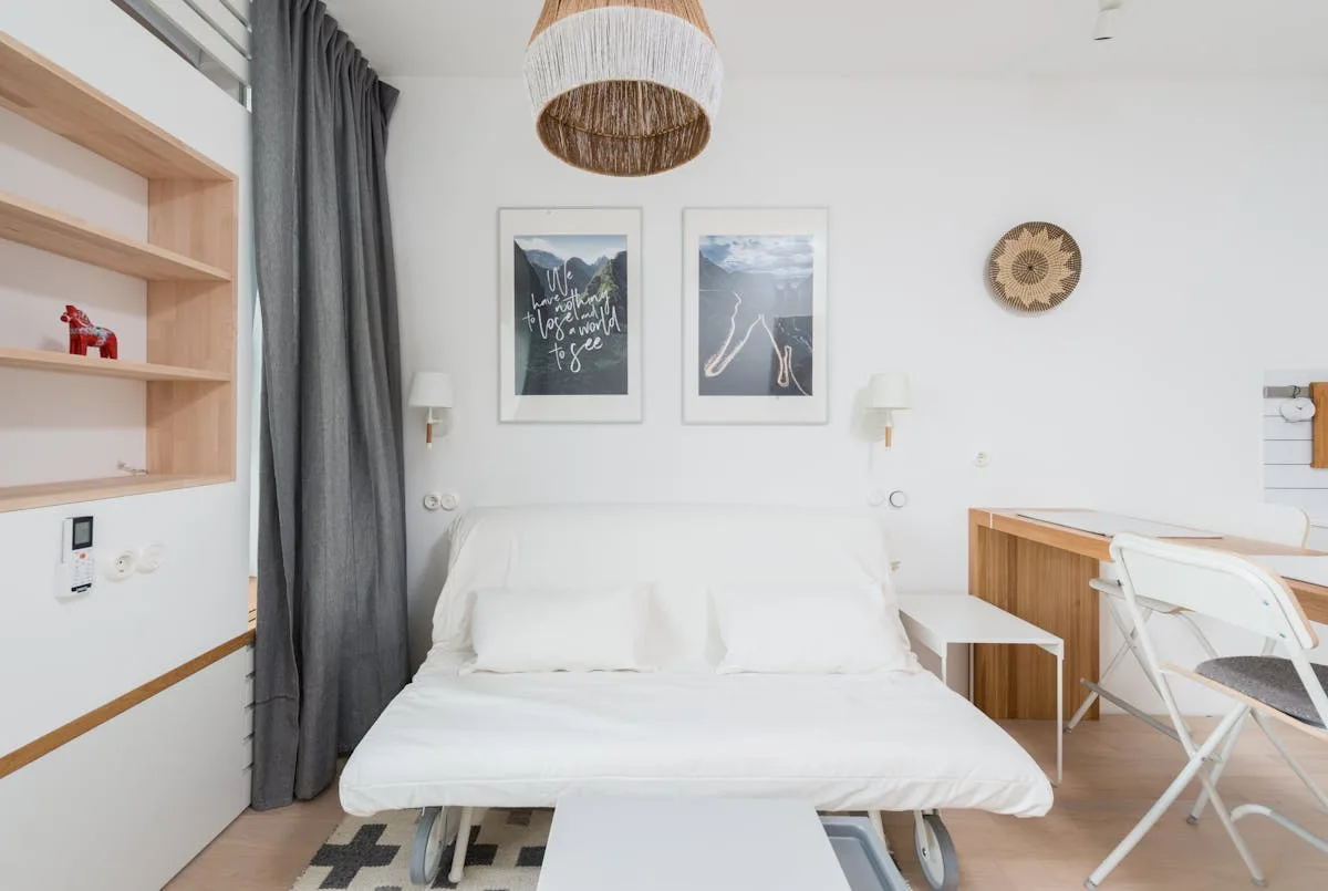 Convertible sofa bed open in a bright studio apartment