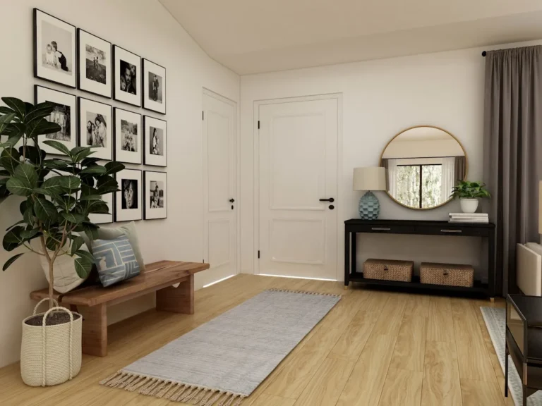 Narrow console table with a mirror and plant in a bright apartment entryway