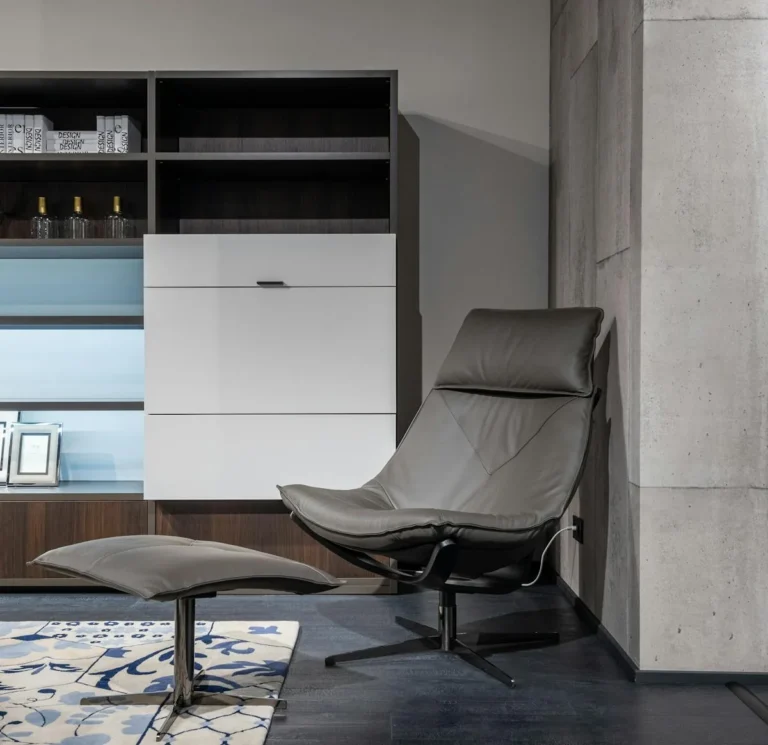Soft fabric storage ottoman holding folded blankets in a living room