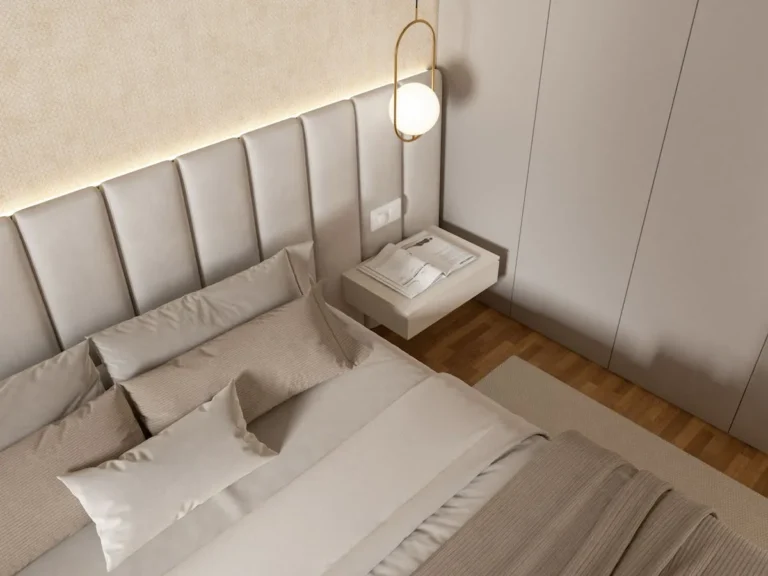 Upholstered platform bed with a padded headboard in a bright small bedroom