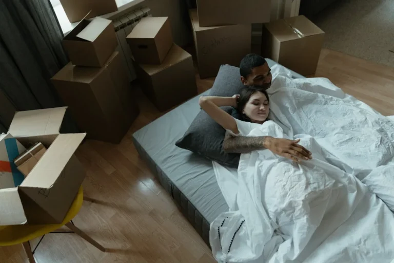 Rolling storage bins stored under a bed