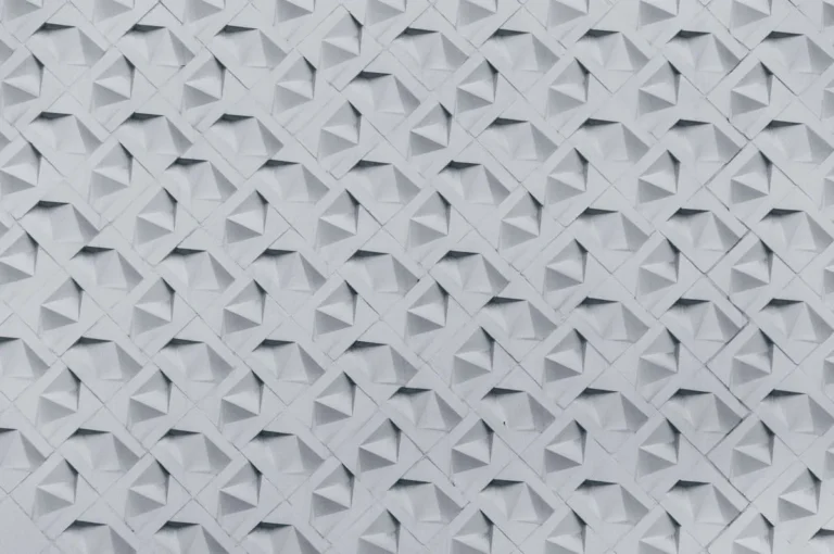 Three-dimensional white geometric wall panel close-up