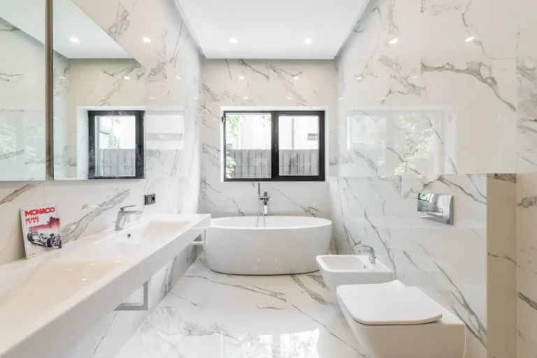 Bright marble bathroom with a freestanding tub