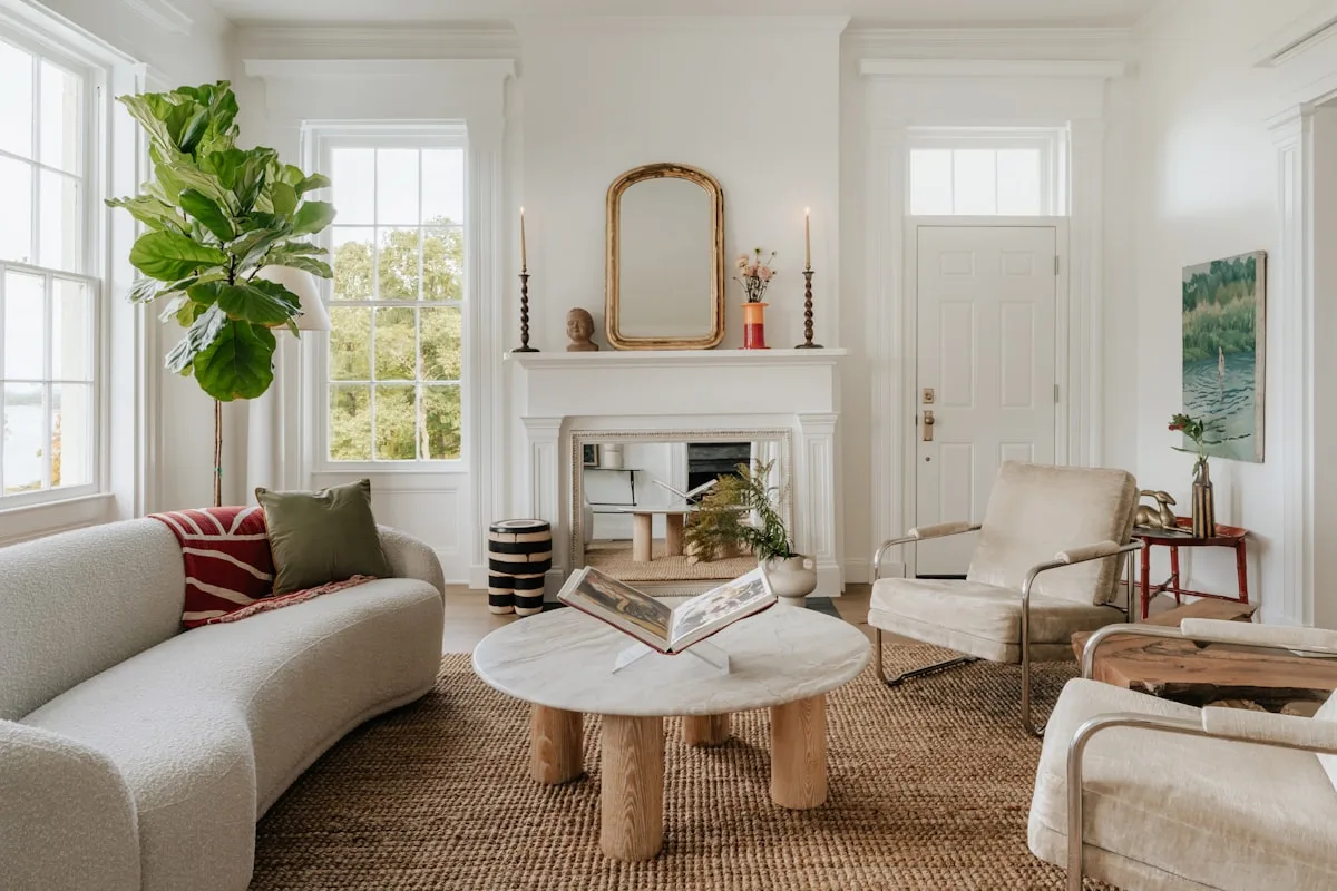 Bright airy small apartment living room with a light sofa and a jute rug