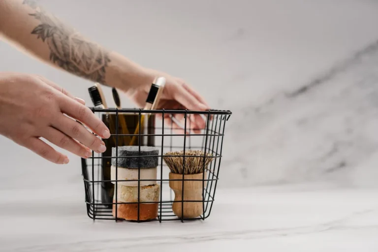 Wire basket organizer holding cleaning supplies